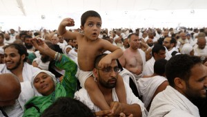 Muslim pilgrims arrive to cast stones at pillars symbolizing Satan, during the annual haj pilgrimage, on the first day of Eid al-Adha in Mina